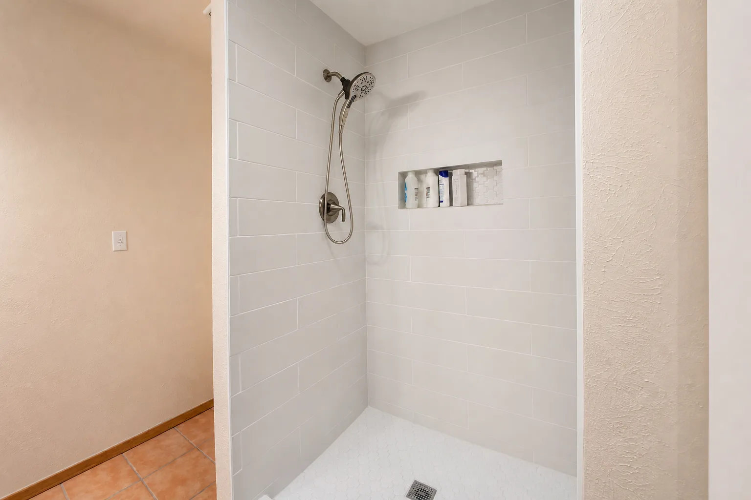 Built-in shower niche with tile detail