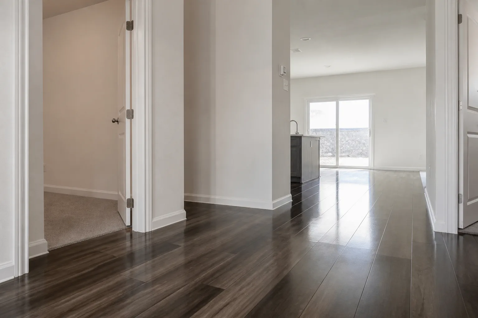Wide-plank flooring flowing through an open floor plan