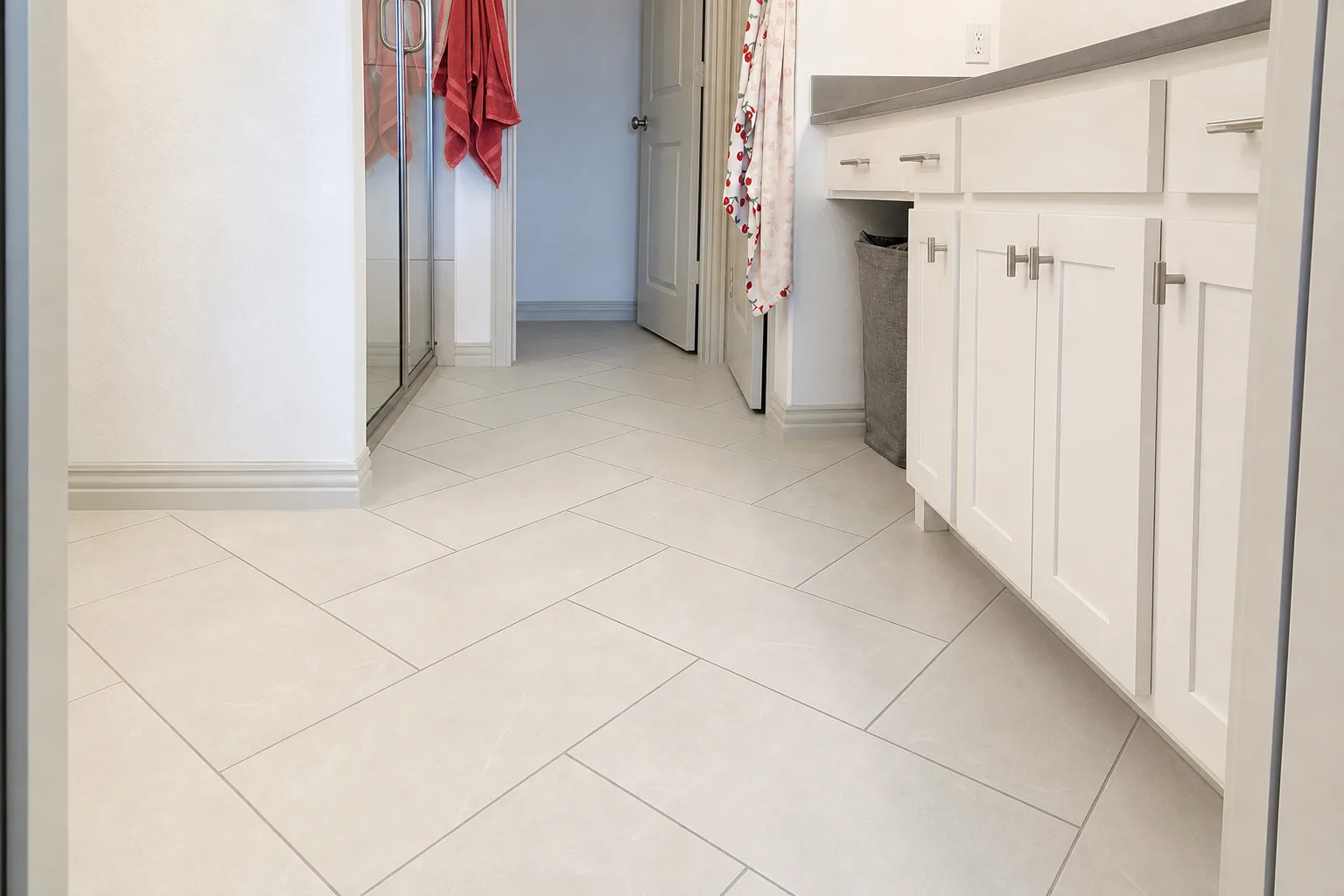 Large-format tile flooring, primary bath hallway