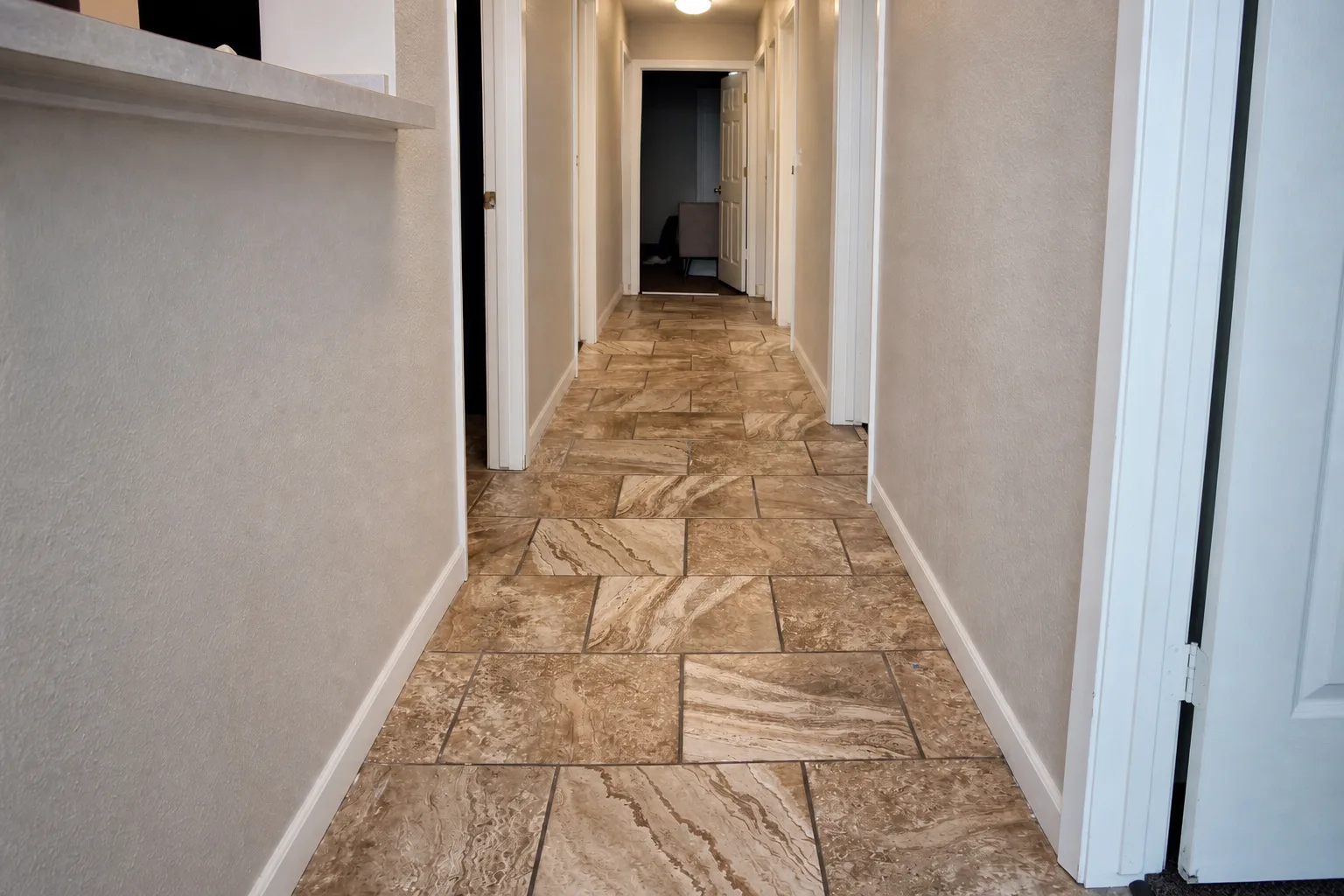 Herringbone tile flooring, hallway view